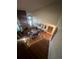 Overhead view of open living space with hardwood floors, brick fireplace, and abundant natural light at 14131 E Baltic Pl, Aurora, CO 80014