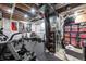 Finished basement featuring gym equipment, exposed ductwork and ceiling, and storage at 14232 Elm St, Thornton, CO 80602