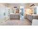 Spacious bathroom with dual vanities, glass-enclosed shower, and modern finishes at 14232 Elm St, Thornton, CO 80602