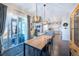 Light-filled dining room with a view to living room and covered patio at 14232 Elm St, Thornton, CO 80602