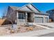 Inviting single-Gathering home with a well-kept front yard, quaint porch, and convenient three-car garage at 14232 Elm St, Thornton, CO 80602
