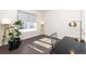 Bright office space featuring hardwood floors, a large window, and modern lighting, ideal for productivity at 14232 Elm St, Thornton, CO 80602
