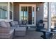 Relaxing outdoor patio with comfortable seating, stylish decor, and natural light at 14232 Elm St, Thornton, CO 80602