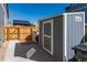 Backyard shed with a concrete base, perfect for storage, and adjacent to a fenced area at 14232 Elm St, Thornton, CO 80602