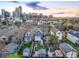 Aerial shot of residential neighborhood with well-maintained backyards and views of the city skyline at 2244 N Washington St, Denver, CO 80205