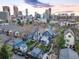 Urban aerial view of Denver homes with skyline backdrop, showcasing a vibrant neighborhood setting at 2244 N Washington St, Denver, CO 80205