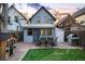 Backyard with a brick patio, dining set, outdoor grill, playhouse and grass, perfect for outdoor enjoyment at 2244 N Washington St, Denver, CO 80205