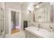 Modern bathroom with gray walls, a single sink, and a glass shower door at 2244 N Washington St, Denver, CO 80205