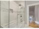 This elegant bathroom has tub and shower with a decorative tile backsplash at 2244 N Washington St, Denver, CO 80205