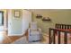 This charming Bedroom has hardwood floors, bookshelves, and a comfortable chair at 2244 N Washington St, Denver, CO 80205