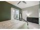 Bright bedroom with a black bedframe, full-length mirror, dark dresser, and light gray carpeting at 2244 N Washington St, Denver, CO 80205