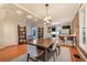 Bright dining area with wood table, exposed brick accents, and easy access to a sleek, modern kitchen at 2244 N Washington St, Denver, CO 80205