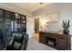 The office features a sleek black bookcase and decorative wood cabinet at 2244 N Washington St, Denver, CO 80205