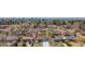 Aerial shot of a charming neighborhood with mature trees and a city skyline in the background at 2441 Niagara St, Denver, CO 80207