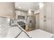 Bright kitchen featuring stainless steel appliances, quartz countertops, and mosaic backsplash at 2441 Niagara St, Denver, CO 80207