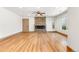 Spacious living room featuring a modern electric fireplace, wood floors, and neutral paint at 2441 Niagara St, Denver, CO 80207