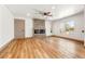 Spacious living room featuring a modern electric fireplace, wood floors, and neutral paint at 2441 Niagara St, Denver, CO 80207