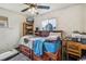 Cozy bedroom featuring a full-sized bed, ceiling fan and bright, natural light at 7940 Pontiac St, Commerce City, CO 80022