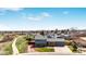 Scenic aerial view of the charming home surrounded by lush greenery and a walking path, showcasing its prime location at 6376 S Estes St, Littleton, CO 80123