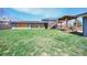 Expansive backyard with mature lawn, perfect for outdoor activities at 6376 S Estes St, Littleton, CO 80123
