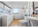 Bright bathroom with laundry, and a stylish sink at 6376 S Estes St, Littleton, CO 80123