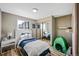 Colorful bedroom with laminate flooring, and a whimsical decor at 6376 S Estes St, Littleton, CO 80123