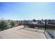 Deck with metal railing overlooking neighborhood provides outdoor living at 6376 S Estes St, Littleton, CO 80123