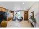 Warm entryway with tile flooring, built-in wood cabinets, and stylish decor creating a welcoming atmosphere at 6376 S Estes St, Littleton, CO 80123