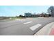 Split-level home featuring a partial brick facade and a two-car garage, set on a well-maintained lot at 6376 S Estes St, Littleton, CO 80123