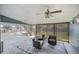 Covered patio with seating and ceiling fan, ideal for outdoor relaxing and entertaining at 6376 S Estes St, Littleton, CO 80123