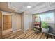 Charming room with wood flooring, a bright window, and plants at 6376 S Estes St, Littleton, CO 80123