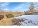 Backyard featuring a mix of brush and snow covered ground at 4678 S Salida St, Aurora, CO 80015