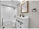 Updated bathroom boasts a modern vanity and shower-tub combo at 4678 S Salida St, Aurora, CO 80015