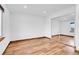 Bedroom with laminate flooring, closet doors, and a window at 4678 S Salida St, Aurora, CO 80015