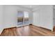 Bedroom with laminate flooring, closet doors, and a sliding glass door at 4678 S Salida St, Aurora, CO 80015