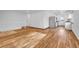 Open concept living and kitchen area with hardwood floors and white walls at 4678 S Salida St, Aurora, CO 80015