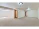 Spacious basement with neutral carpet, white walls, and ample lighting provides versatile living space at 2585 E Egbert St, Brighton, CO 80601