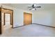 Bedroom with carpet, ceiling fan, closet, and views to hallway at 2585 E Egbert St, Brighton, CO 80601