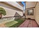 Backyard features green space, patio, and wooden planter boxes at 1829 S Pitkin Cir, Aurora, CO 80017