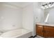 Full bathroom with white tiled shower and floors at 1829 S Pitkin Cir, Aurora, CO 80017