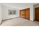 Bedroom with double closet and large window at 1829 S Pitkin Cir, Aurora, CO 80017