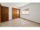 Bright bedroom features a window and closet for storage at 1829 S Pitkin Cir, Aurora, CO 80017