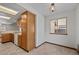 Kitchen area with tile flooring and a window looking out at the side of the house at 1829 S Pitkin Cir, Aurora, CO 80017