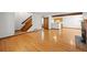 Spacious living room with hardwood floors, staircase, and open layout, ideal for entertaining and everyday living at 1829 S Pitkin Cir, Aurora, CO 80017