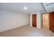Finished basement bedroom featuring a closet, carpeted floor, and view to an adjacent hallway at 2713 W Long Dr # C, Littleton, CO 80120