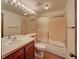 Bathroom featuring a tub/shower combination, a large mirror, and a vanity sink at 2713 W Long Dr # C, Littleton, CO 80120