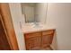 Cozy bathroom with wood vanity, light countertops, and an elegant round sink at 2713 W Long Dr # C, Littleton, CO 80120