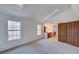 Bright bedroom with carpet, natural light from windows, and an ensuite vanity area at 2713 W Long Dr # C, Littleton, CO 80120