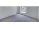 Cozy bedroom with plush carpeting and a bright window letting in natural light at 2713 W Long Dr # C, Littleton, CO 80120