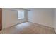 Finished basement bedroom featuring a carpeted floor and a small window at 2713 W Long Dr # C, Littleton, CO 80120
